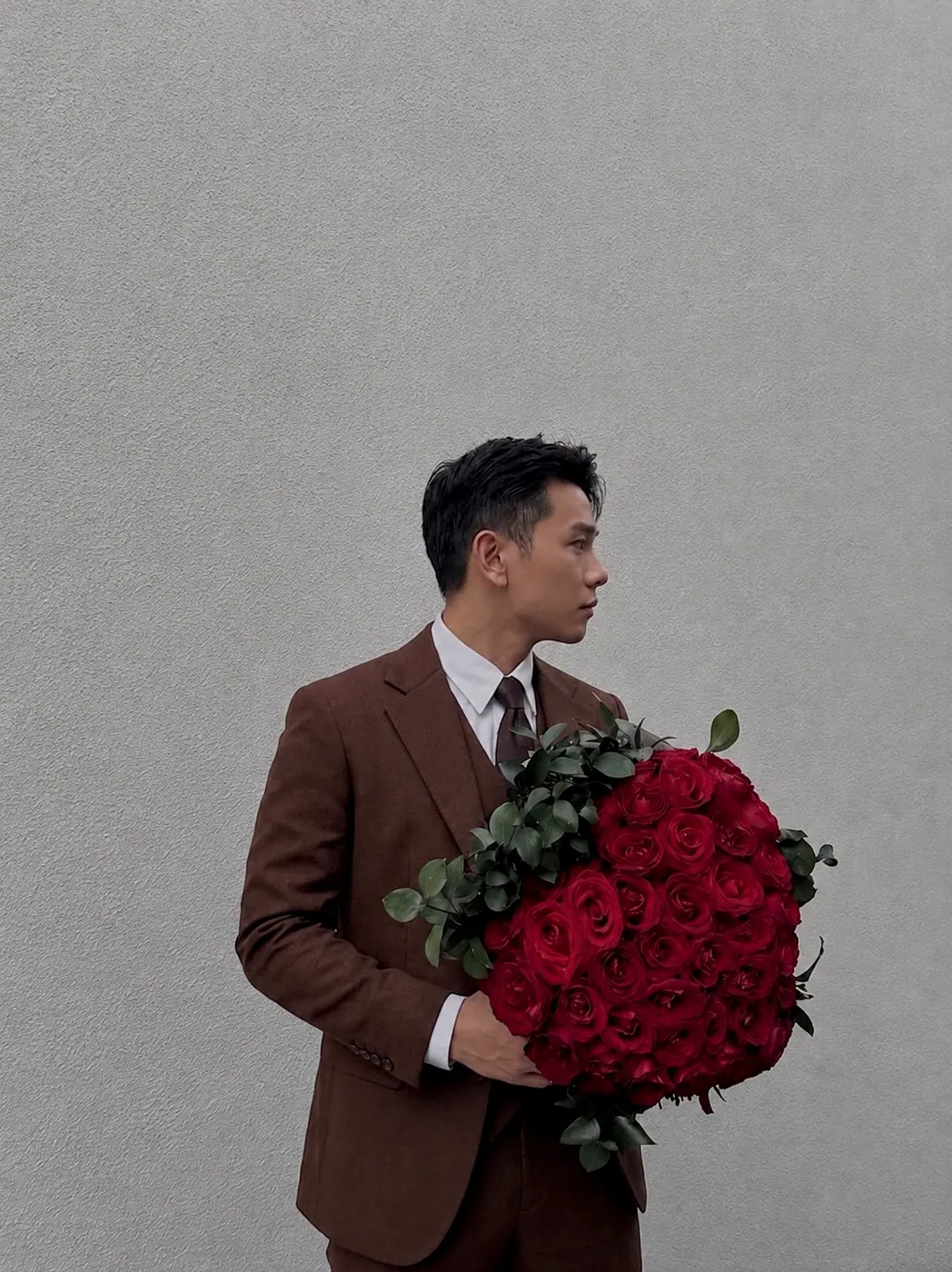 85 red roses arranged in a heart